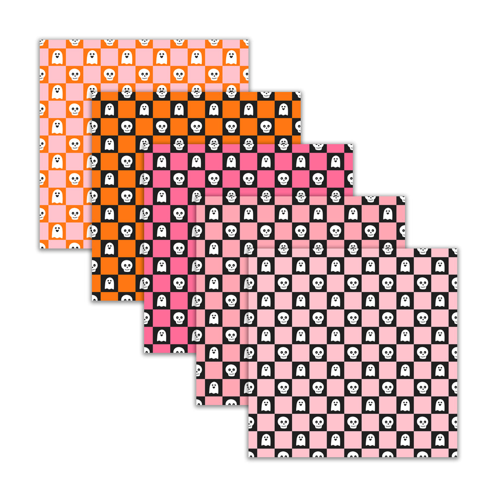 Set of four placemats with Halloween-themed checkered patterns on a white background