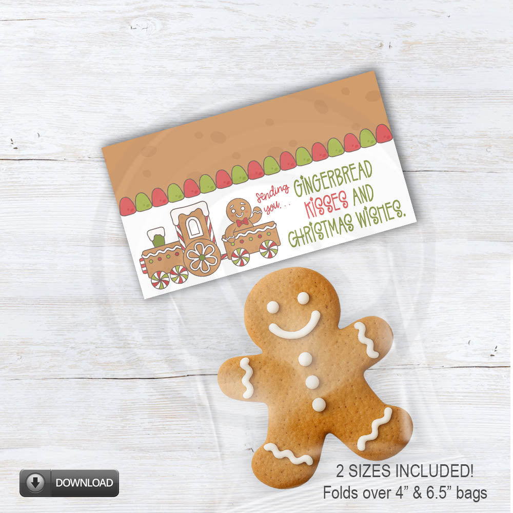 Printable gingerbread bag topper featuring a cute gingerbread train with gumdrop border and the phrase “Sending you gingerbread kisses and Christmas wishes,” folded over a clear treat bag with a gingerbread cookie.