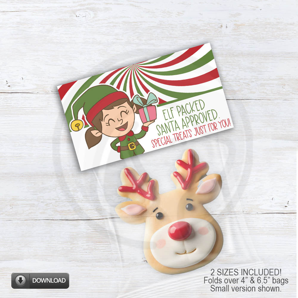 Elf Packed Santa Approved Christmas treat bag topper printable featuring a smiling girl elf holding a present with red, green, candy-swirl background. Holiday goodie bag label for classroom treats, two sizes included.