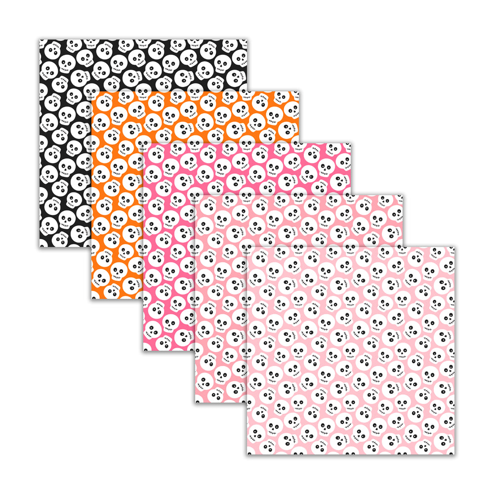 Set of four patterned paper sheets with skull designs on a white background