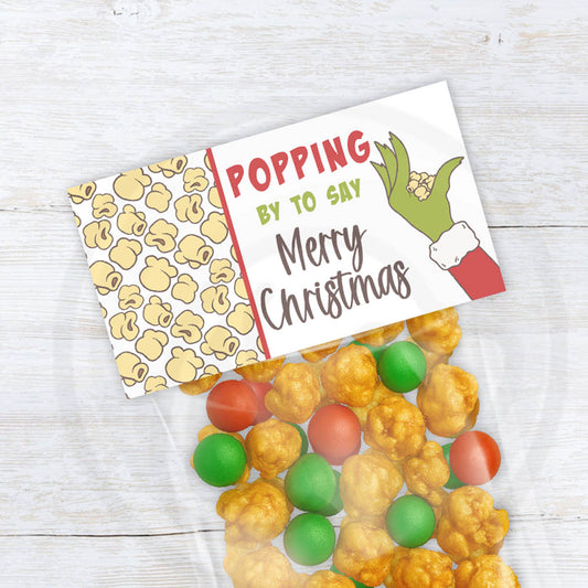 Printable Christmas holiday "Popping by to say Merry Christmas" popcorn treat bag topper. Two sizes included in download. Popcorn background with cute green hand and trendy fonts.