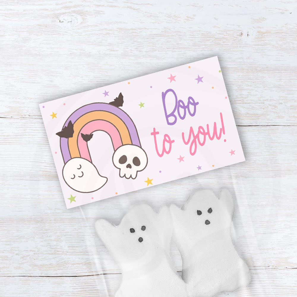 Pastel Boo to You Halloween treat bag topper with a rainbow, cute ghost, skull, flying bats, and colorful stars.