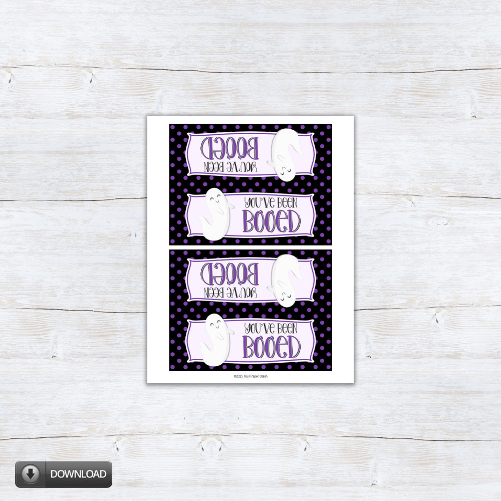 Printable Halloween bag topper with “You’ve Been Booed” wording, a smiling white ghost, and a black border covered in purple polka dots, available for 4" and 6.5" bags.