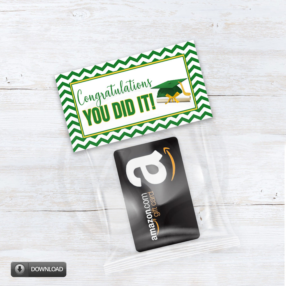 Graduation-themed gift card with 'Congratulations YOU DID IT!' text and Amazon gift card on a wooden surface.