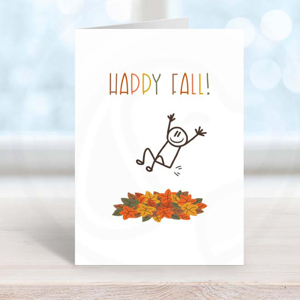 printable happy fall greeting card with stick man jumping into a pile of leaves