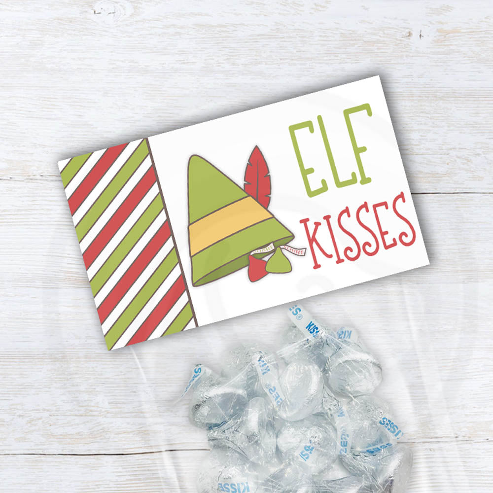 Printable Elf Kisses Christmas treat bag toppers for cookie and candy bags. Design includes cute elf hate with kisses candy clipart, kid friendly fonts, and green and red striped background pattern. Instant download item, 2 sizes included.