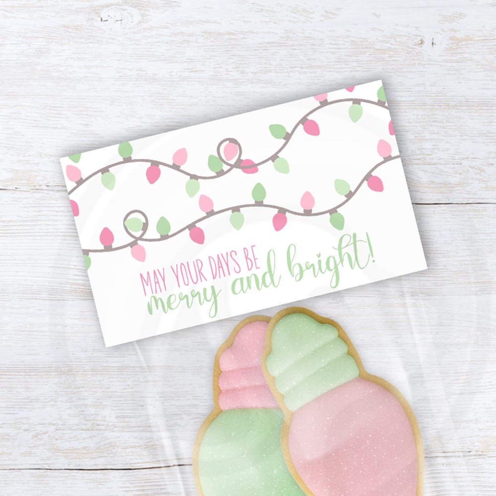 Pastel Christmas treat bag topper with mint and pink light bulb string design and “May Your Days Be Merry and Bright” text, printable holiday favor topper.