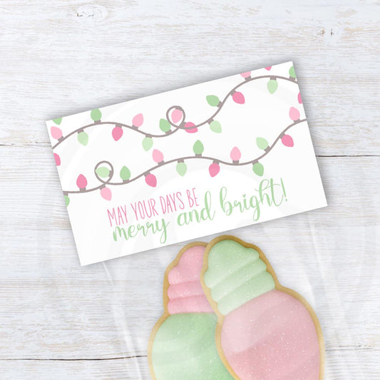 Pastel Christmas treat bag topper with mint and pink light bulb string design and “May Your Days Be Merry and Bright” text, printable holiday favor topper.
