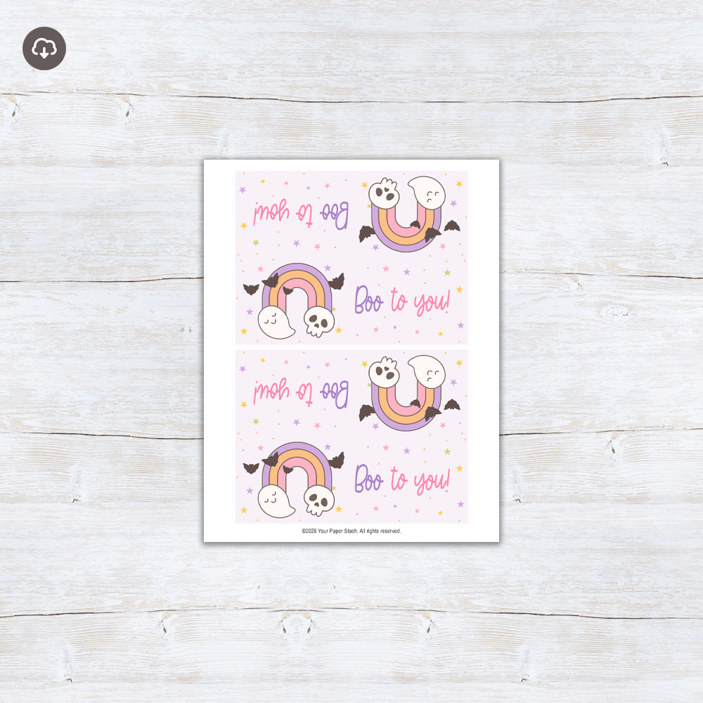 Pastel Boo to You Halloween treat bag topper with a rainbow, cute ghost, skull, flying bats, and colorful stars.