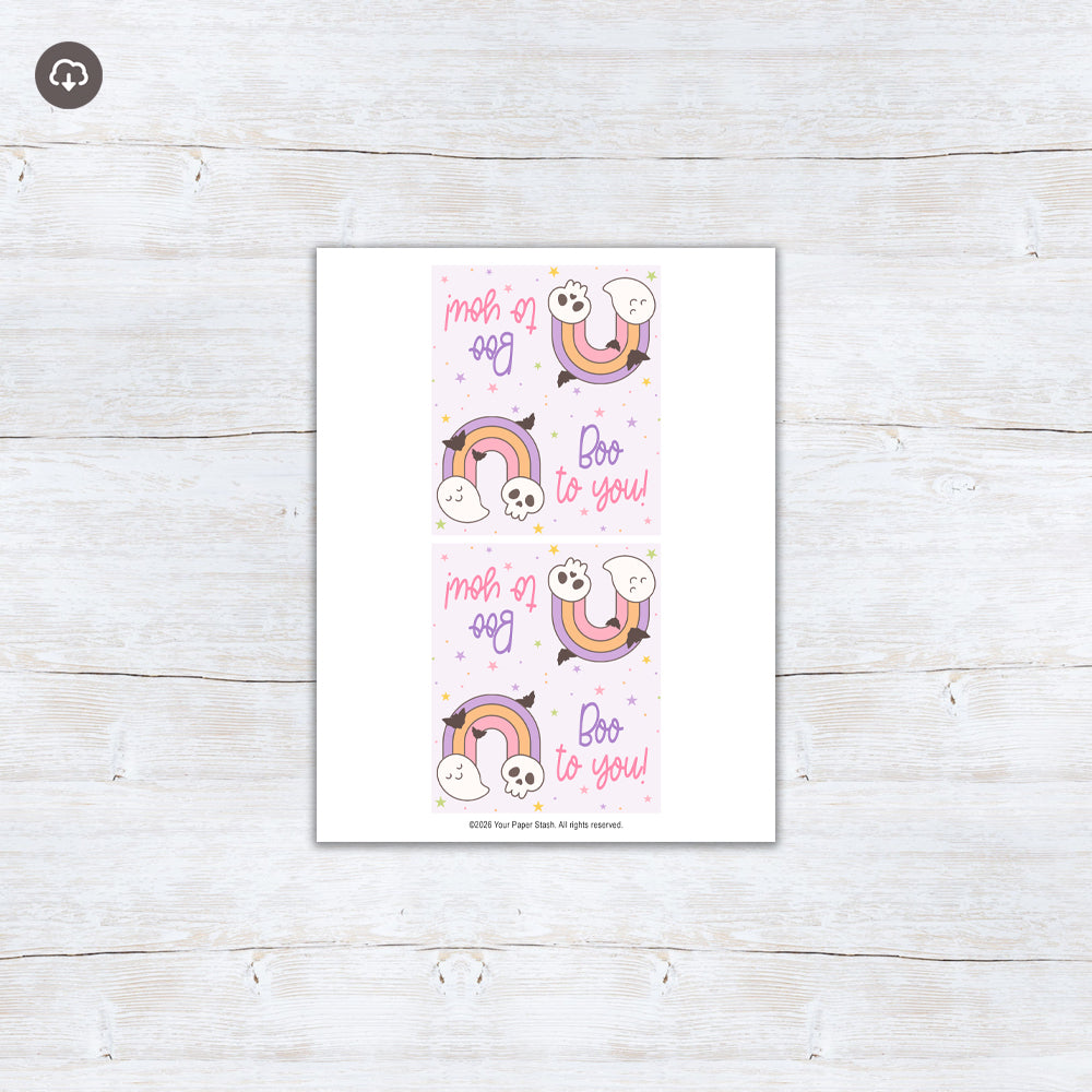 Pastel Boo to You Halloween treat bag topper with a rainbow, cute ghost, skull, flying bats, and colorful stars.