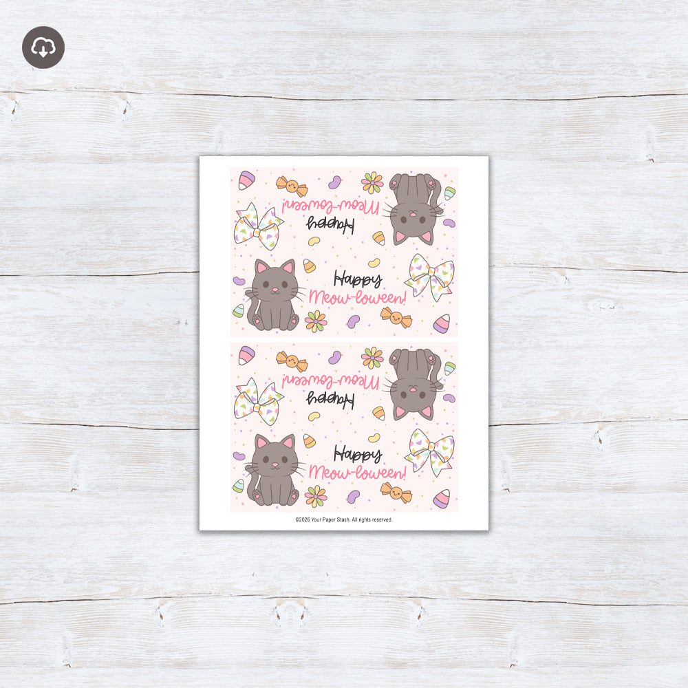 Happy Meow-loween printable Halloween treat bag topper with a cute charcoal gray cat, floral bow, colorful candy, flowers, and pastel stars.