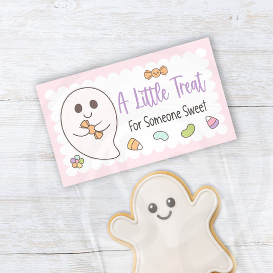 Pink printable ghost treat bag topper with pastel candy, lavender lettering, a scalloped frame, and the message A Little Treat for Someone Sweet.