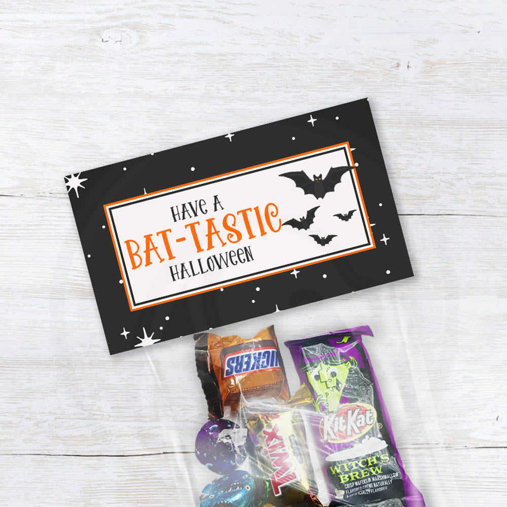 Bat-Tastic Halloween treat bag topper printable featuring black bats, orange lettering, and a black starry background.