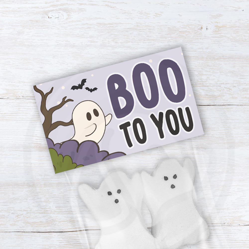 Printable Boo to You Halloween bag topper with a friendly ghost, bats, trees, and purple and green accents.