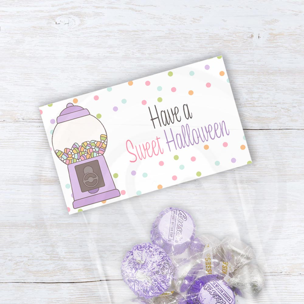 Have a Sweet Halloween printable treat bag topper with a pastel candy machine, colorful sweets, and scattered polka dots.