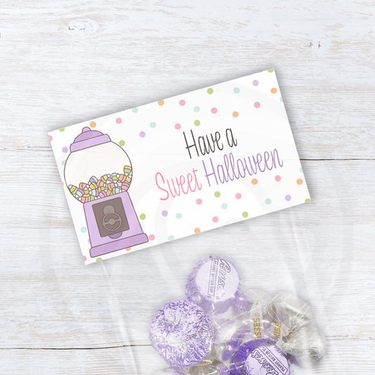 Have a Sweet Halloween printable treat bag topper with a pastel candy machine, colorful sweets, and scattered polka dots.