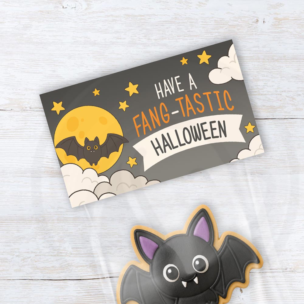 Printable Halloween treat bag topper featuring a cute bat, moon, stars, and “Have a Fang-tastic Halloween” wording.
