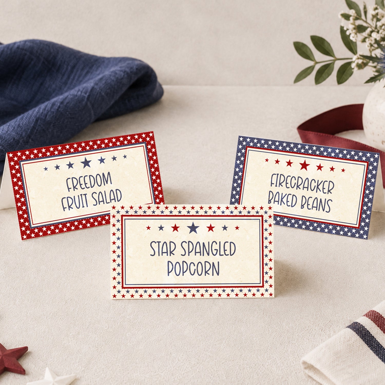 Printable patriotic food label tent cards with red, white, and blue star borders for 4th of July parties, BBQ buffets, potlucks, America 250 events, and patriotic table decor.